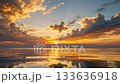 Sunset sky and flowing clouds reflected on the sea 133636918