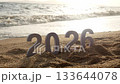 number 2026 for new year sign on summer beach at sunset time, with ripple sea wave and beautiful nature at background, 2026 New Year celebration concept 133644078