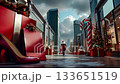 A woman in a santa claus outfit walking down a city street with presents and a candy cane 133651519