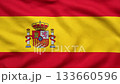Spanish flag waving from an aerial overhead perspective, red and yellow stripes with national coat of arms, patriotic seamless video background symbolizing Spains identity 133660596