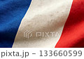Top down aerial view of the France flag waving in the wind, tricolor blue white red design, smooth flowing fabric, elegant patriotic background for national events and video presentations 133660599
