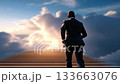 A man in a suit walking up a set of stairs 133663076