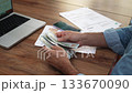 Business company accountant computes number of banknotes over documents on table, old man observes currency exchange rates managing financial obligations slow motion 133670090