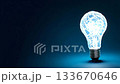 Light bulb with glowing lines against a dark background showing creativity and innovation 133670646