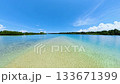 Clear blue lagoon with sandy bottom visible through shallow water. Siargao, Philippines. 133671399