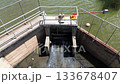 Drone View of Dam Sluice Gate and Water Release 133678407