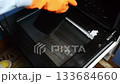 Black oven door with a clear glass window 133684660
