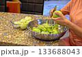 Peeling apples with knife 133688043