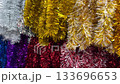 Christmas multicoloured tinsel background. 4K 133696653