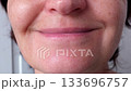 Gentle transformation from neutral to happy expression showcasing subtle emotional shift and facial movement 133696757
