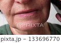 Closeup of Mature woman speaking on phone: expressive conversation and communication dynamics 133696770