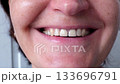 Closeup sequence of woman's joyful expression highlighting bright smile and positive emotion 133696791