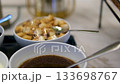 Delicious creamy soup with croutons served in a silver bowl for a gratifying meal 133698767
