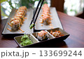 salmon roll with chopsticks.Japanese cuisine 133699244