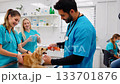 Vet students care for golden retriever pup in clinic. Ai generated 133701876