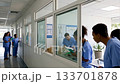 Healthcare pros in scrubs collaborate in modern clinic. Ai generated 133701878