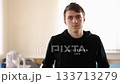 recovery process, personal recovery, supportive setting. Young man likely in rehab demonstrates resilience and dedication to his recovery in nurturing setting. 133713279