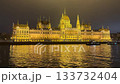 Hungary Budapest Hungarian Parliament on the Danube river at night. 133732404