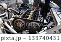 Mechanic repairing car engine at auto service workshop 133740431