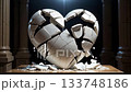 A large heart sculpture made of white material rests on a wooden pedestal. The heart is cracked and broken, conveying deep emotions of love and heartbreak in a striking modern art display. 133748186