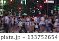 Tokyo, Japan: Crowds of people walking in the downtown area at night, traffic flow on the main street, downtown scenery (time lapse photography) 133752654