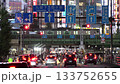 Shinjuku, Tokyo, Japan: Streets around Kabukicho, densely packed buildings and cars on the main street, a nighttime scene of the downtown area with glittering neon lights 133752655