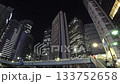 Tokyo, Japan: Skyscrapers around Nishi-Shinjuku Night view of the office building district (time-lapse photography) 133752658