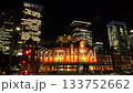 Tokyo, Japan: Tokyo Station and skyscrapers, business district at night (time lapse photography) 133752662