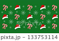 Festive Christmas pattern with santa hats candy canes and snowflakes on green background. 133753114