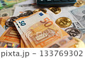 Background with US Dollar and Euro bills, BTC bitcoins and bills to pay. 133769302