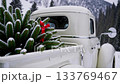 Vintage truck with snowdusted christmas tree in winter mountain landscape 133769467