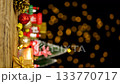 Christmas ornament items decoration on wooden table with copy space, for shopping promotion marketing during season greetings Merry Christmas with bokeh light at background, seamless looping 133770717