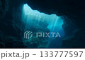Sunbeams illuminating an underwater cave from below 133777597