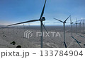 Wind Farm Turbines at San Gorgonio Pass near Palm Springs, California - Drone Pan Right 133784904