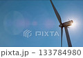 Static low angle shot of wind turbine operating in the San Gorgonio Pass near Palm Springs, California. Renewable energy infrastructure in a desert mountain landscape under clear skies. 133784980