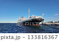 Yamashitacho, Yokohama, Kanagawa, Japan, black passenger ship docked at harbor on clear sunny day 133816367