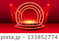 Shining stage with bright lights for a grand performance, vibrant red backdrop for product showcase, dynamic spotlighting emphasizes center focus 133852774