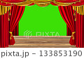 Elegant stage curtains opening reveal a classic theater performance space with wooden stage, perfect for presentations or theatrical productions 133853190