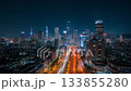 City night view time lapse: Cityscape with skyscrapers and moving car light trails 133855280