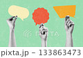 Hands holding colorful speech bubbles sharing ideas and thoughts in a creative workshop setting 133863473
