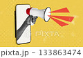Hand with megaphone emerging from phone screen on bright yellow background displays message about communication and activism 133863474