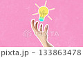 Hand reaches out against a bright pink background, showcasing creativity and artistic expression 133863478