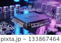 Close up of modern CPU chip mounted on reflective circuit board surface, with cool blue and magenta lighting emphasizing fine metal legs 133867464
