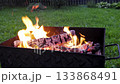 Hot red coals burn brightly. BBQ wood on fire.	 133868491