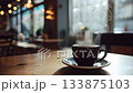 A coffee cup on a cafe table, steam rising from it, seamless loop video (generated AI video) 133875103