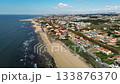 Espinho, Portugal - 12.10.2025: Aerial drone video flying over the coastal town of Espinho, Portugal, showing beautiful beaches, ocean waves, and red-roofed houses. 133876370