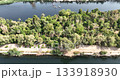 Aswan Egypt - September 17, 2023: Aerial drone views of Aswan rocky islands and elegant sailboats gliding along the Nile, showcasing the city timeless charm and breathtaking natural beauty. 133918930