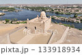 Aswan Egypt - September 17, 2023: Daytime drone footage of the Aga Khan Mausoleum showcases its Carrara marble elegance and iconic presence along the Nile, a landmark admired by visitors worldwide. 133918934