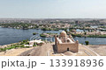 Aswan Egypt - September 17, 2023: Aerial tour of the Aga Khan Tomb highlights its pink limestone architecture and red rose tradition, set against the breathtaking desert and Nile backdrop of Aswan. 133918936