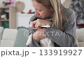 Gentle Pet Care, Affectionate Woman Performs Gentle Dental Routine With Her Puppy In Cozy Setting 133919927